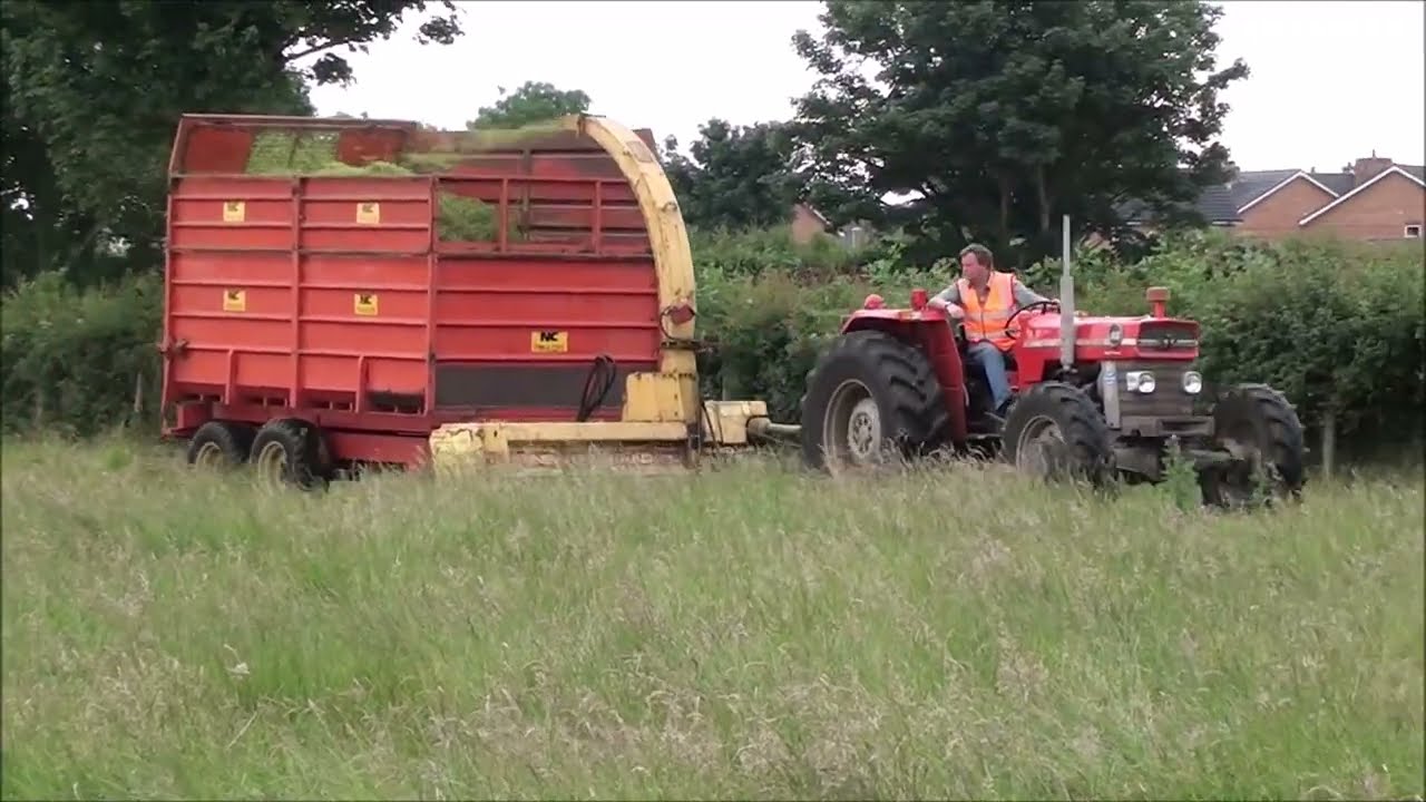 Silage day using classic tractors forage harvesters and silage trailers