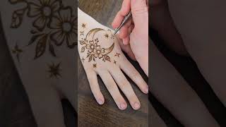 Adding Final Touches To This Floral Moon Henna Design ytshorts moon flower henna hennadesign