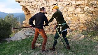 Christian Cameron explaining sword techniques in a Byzantine castle.