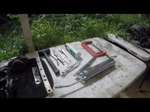 Removing Stuck and Rusted Brake Caliper Pistons with a Grease Gun