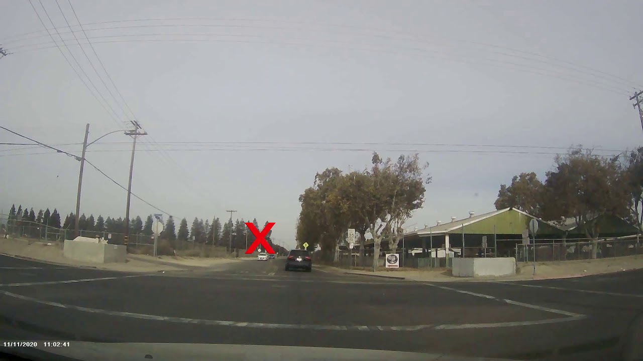 Idiot runs stop sign and almost causes a crash - YouTube