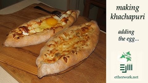 adding egg to khachapuri
