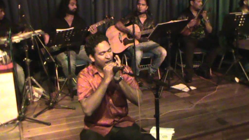 Chanaka Nimantha Fernandoplaying the mouth organ Raa Tharakawosinhala clarance wijewardena