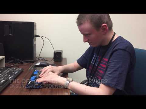 STCC student Daniel Dintzner uses a braille display to read text on a computer screen
