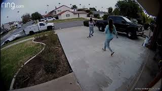 Guy kicks ball in driveway and boy trips over ball
