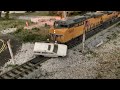Train Hits Car, in N scale! The Dangers of Racing a Train (Railroad Crossing Safely)