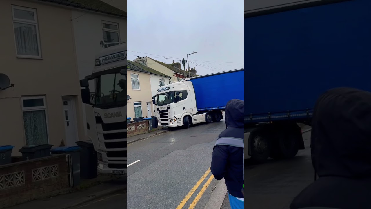 Driver tries to manoeuvre huge truck in tight street and got stuck 