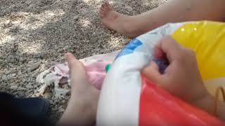 Beach Ball Deflating In Beach In Redo