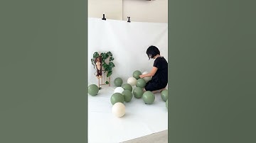 Jungle theme green balloon garland cake smash setup