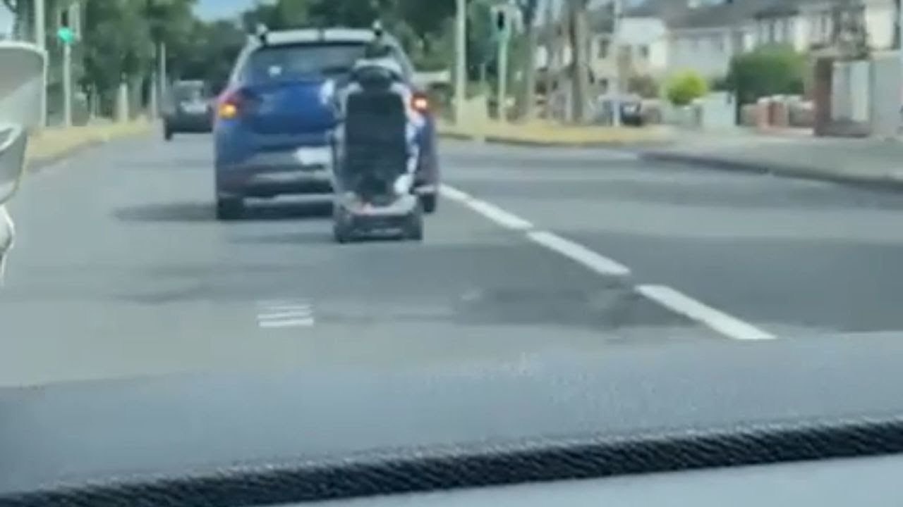 CRAZY mobility scooter fail moment shows man falling off his ride during car turn || WooGlobe