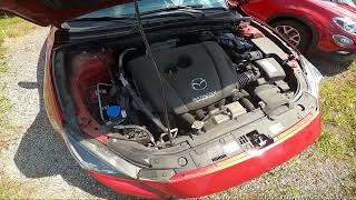Where is the Washer Fluid Reservoir in MAZDA 3 III ( 2013 – 2018 )