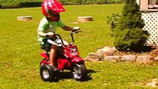 Bub's first ride on the Motovox MBxXSe with training wheels