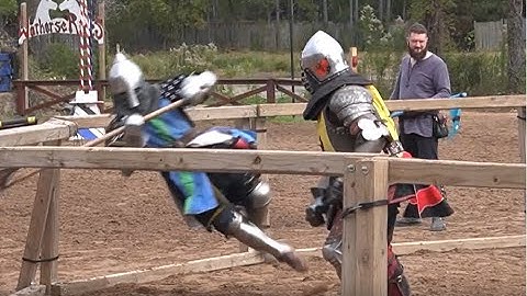 Armored knights in an Axe fight at the Texas Renaissance Festival ends with pommel strike