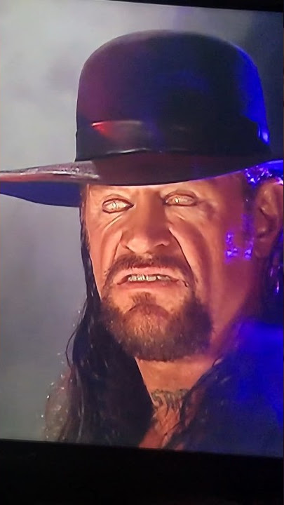 The undertaker rolls eyes back at the audience…