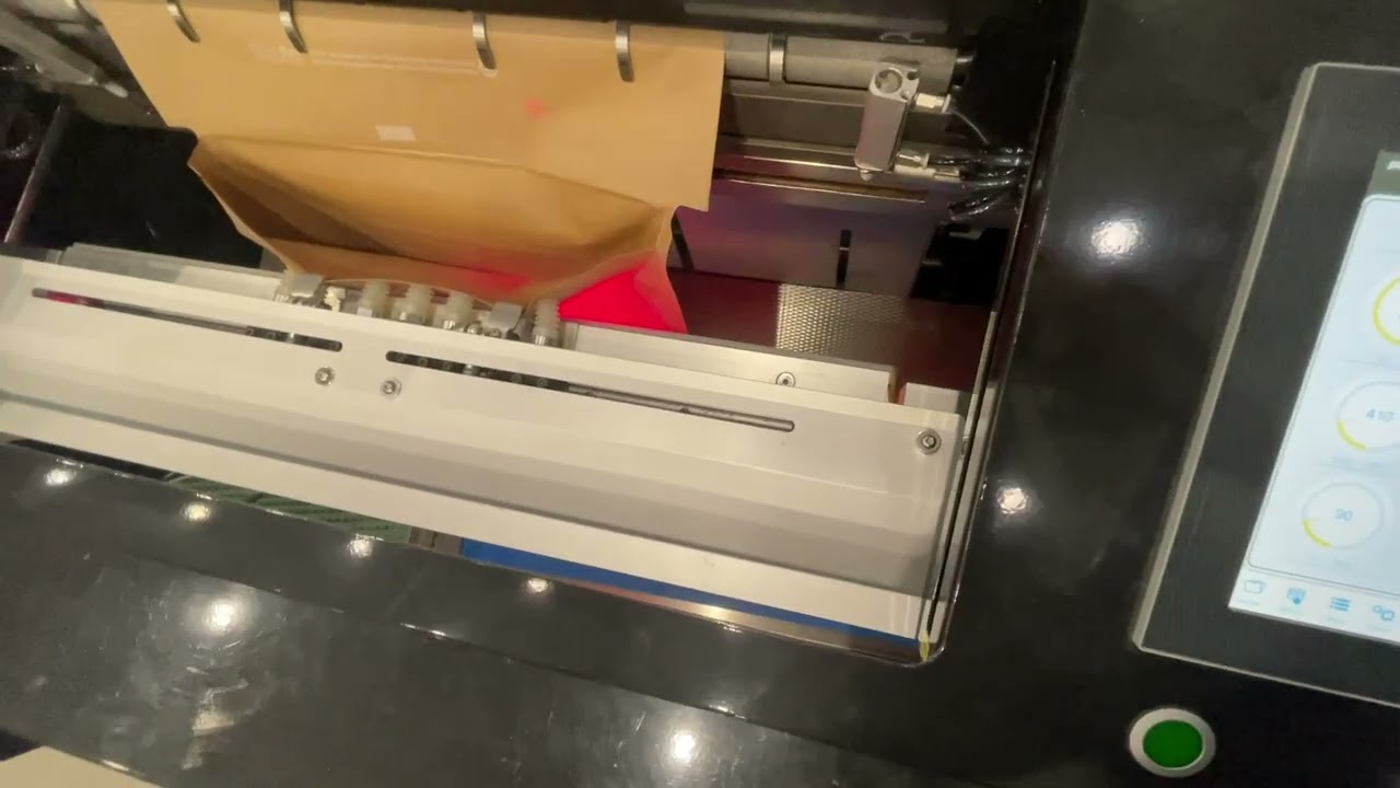 Rollbag R3200XL Fulfillment Paper Auto Bagger - Packing Apparel in Curbside Recyclable Paper Mailers