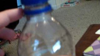 coin through bottle trick-revealed