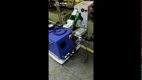 Automated guided vehicle equipped with robotic arm.