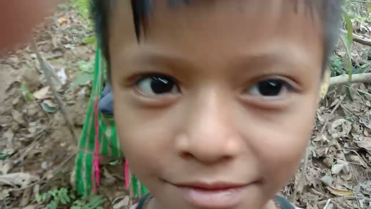 Using small fishing net in the small stream with Jungle Children.