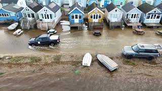 Flooding at Mudeford - High tide lapping up at the steps of the highly sought after beach huts