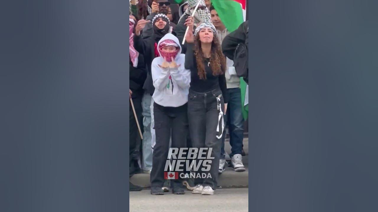 WATCH: Pro and anti Israel protestors stand divided by a line of police in Calgary, AB