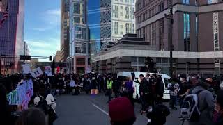 Protesters gather during the first day of jury selection for the trial of Derek Chauvin.