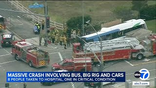 Semi tries to avoid running red light, slams into bus, cars; 11 injured