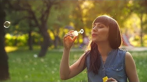 Woman Blowing Soap Bubbles | Stock Footage - Videohive