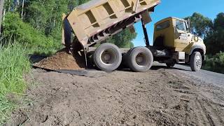 Putting a good driveway in a wet spot.