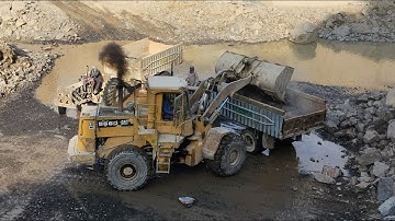 Big & Powerful Caterpillar 966D Wheel Loader Loading Rocks into Dump Trucks and Tractor Trolleys