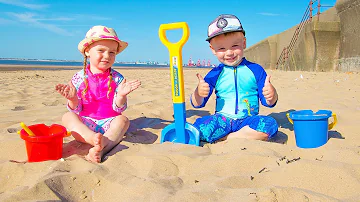 Funny kids playing on the beach with Sand and other Kids Toys | Gaby and Alex