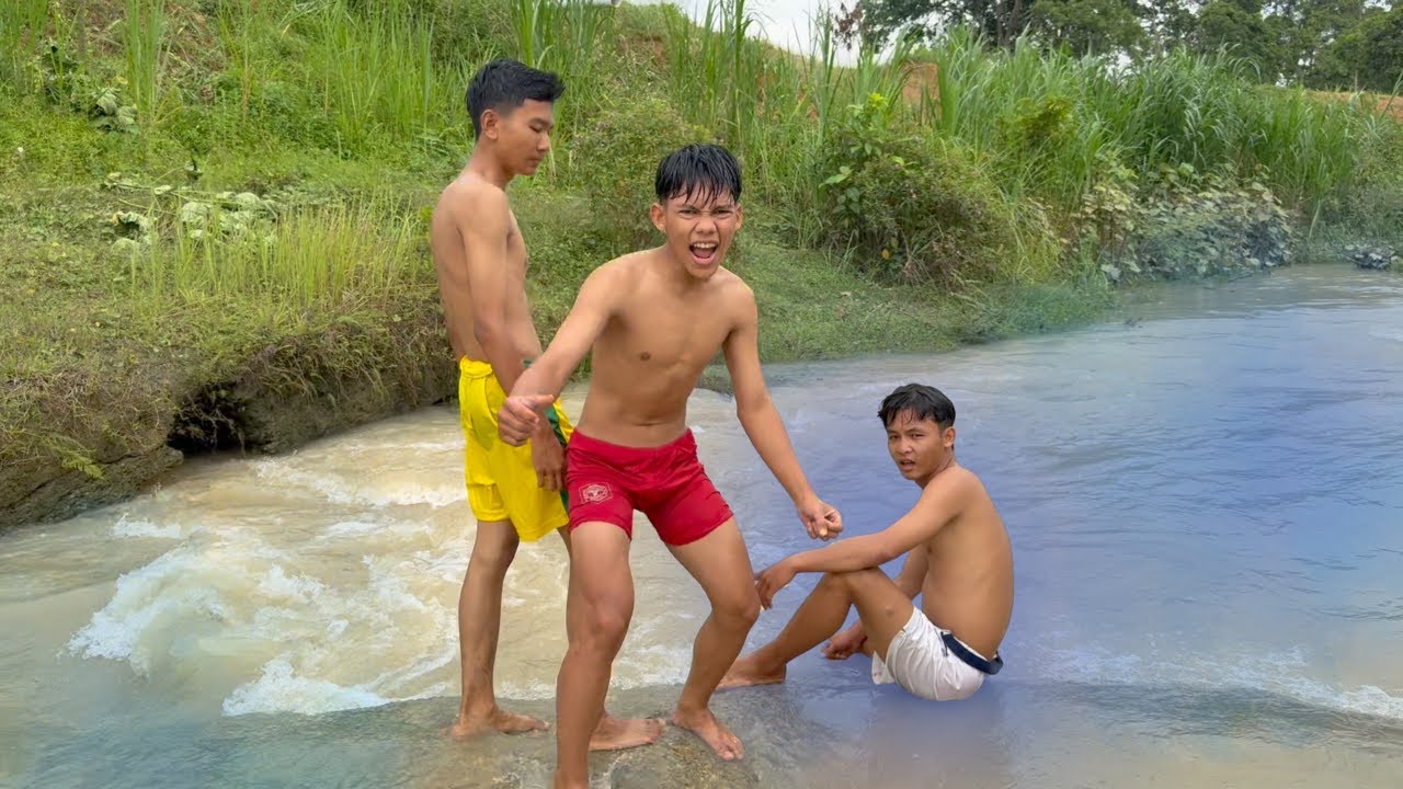 boys swimming on the river