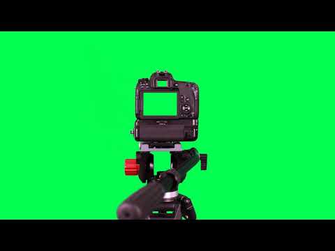 Dslr camera with green screen on the tripod isolated on green screen - free use @bestgreenscreen