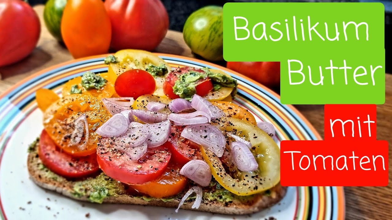 Basilikum-Butter mit Tomaten auf Brot
