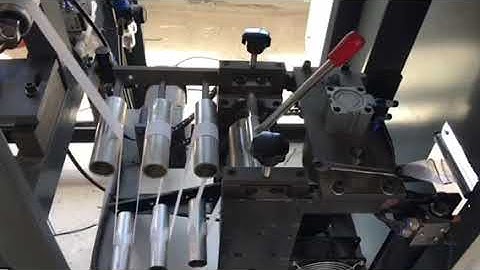 Non woven bag handle attaching machine