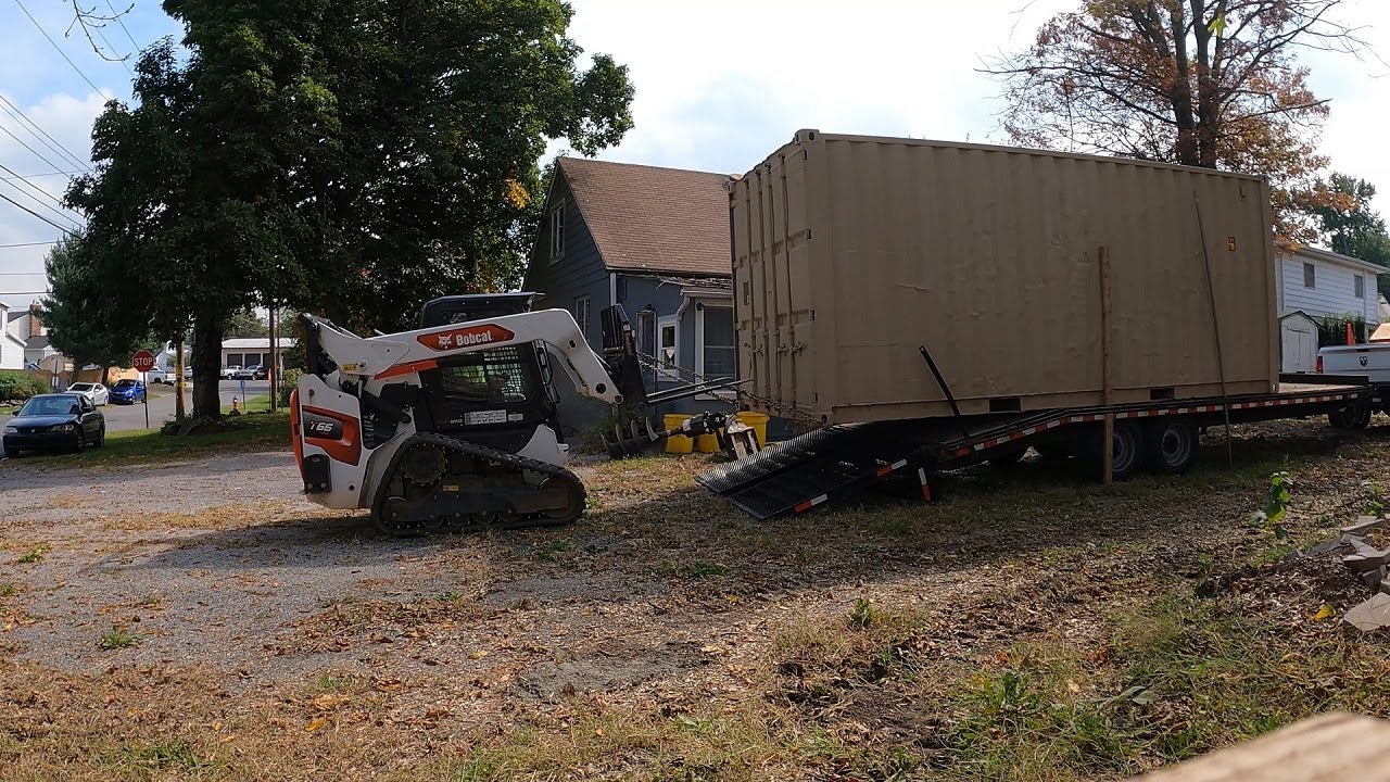 Unloading shipping container with Bobcat T66 YouTube