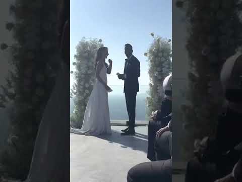 Wind Whips Veil From Bride's Head During Wedding Ceremony