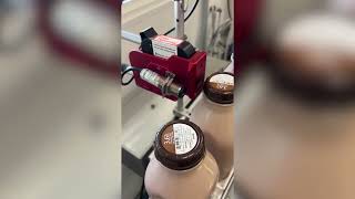 SNEED-JET® Titan Thermal Inkjet Coder Printing on Milk Bottle Caps