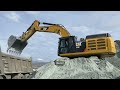 Caterpillar 352F And Caterpillar 385C Excavators Loading Trucks