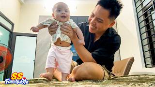 Baby Kim giggled with delight as her dad taught her to walk