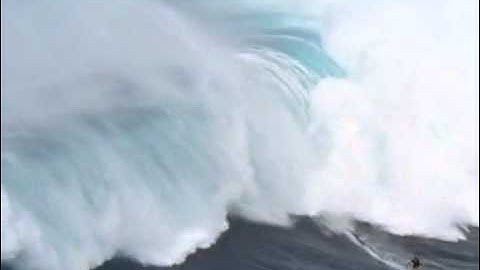 Surfing a Tsunami - Man surfs 65