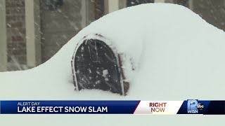 Wisconsinites dig out from a foot of snow in some communities