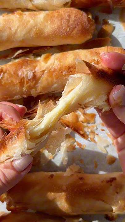 Flaky, buttery layers filled with melty cheese—this Borek will have you hooked! #recipe