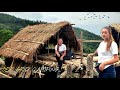Off grid in a typical naga hut  cooking rengmas signature dish and chicken gizzard