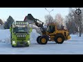 Volvo l70h loading snow on two trucks in 20c winter 202324