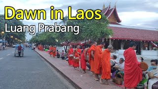 What happen at dawn in Laos. Giving food to monk (religious mendicancy) in Laos, Luang Prabang.