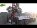 Truck Crane From Palfinger Lifting Concrete Block