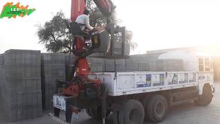 Truck Crane From Palfinger Lifting Concrete Block