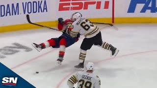 Brad Marchand Knocks Down Matthew Tkachuk With Massive Hit screenshot 1