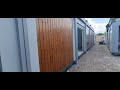 Early timber cladding progress on a modular classroom building