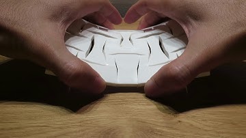 Bistable Auxetic Saddle Surface